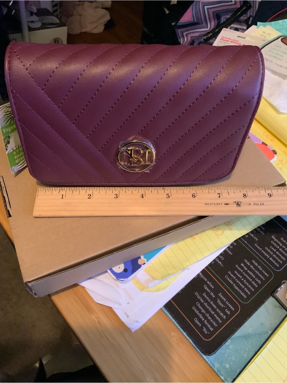 Badgley Mischka Quilted Plum Crossbody bag with Gold Emblem